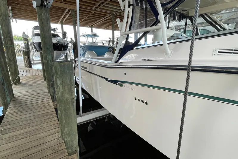  Yacht Photos Pics 2014 Grady-White Freedom 335 boat docked in a marina.