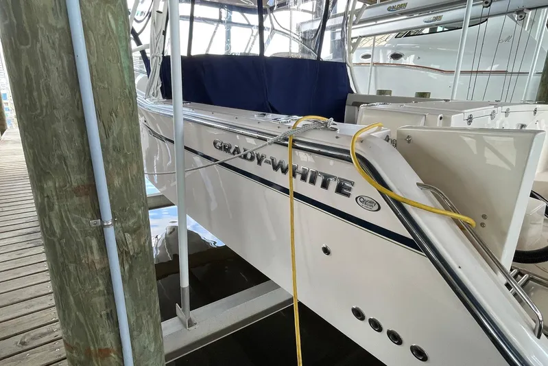  Yacht Photos Pics 2014 Grady-White Freedom 335 boat docked, featuring sleek white design and branding.