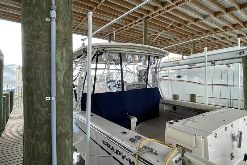 Yacht Photos Pics 2014 Grady-White Freedom 335 boat docked in a covered marina.