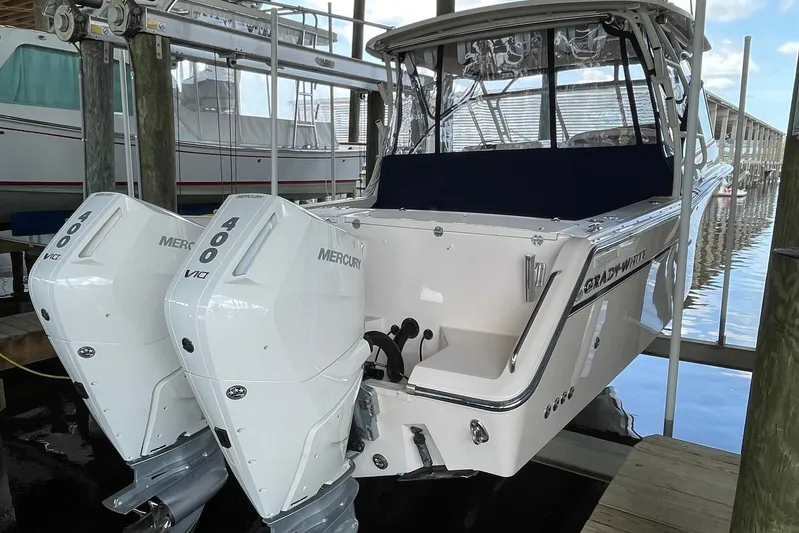  Yacht Photos Pics 2014 Grady-White Freedom 335 boat with twin Mercury 400 engines docked in marina.