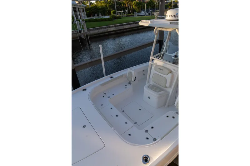  Yacht Photos Pics 2022 Caymas 28 HB Twin boat deck with seating, docked by a canal.