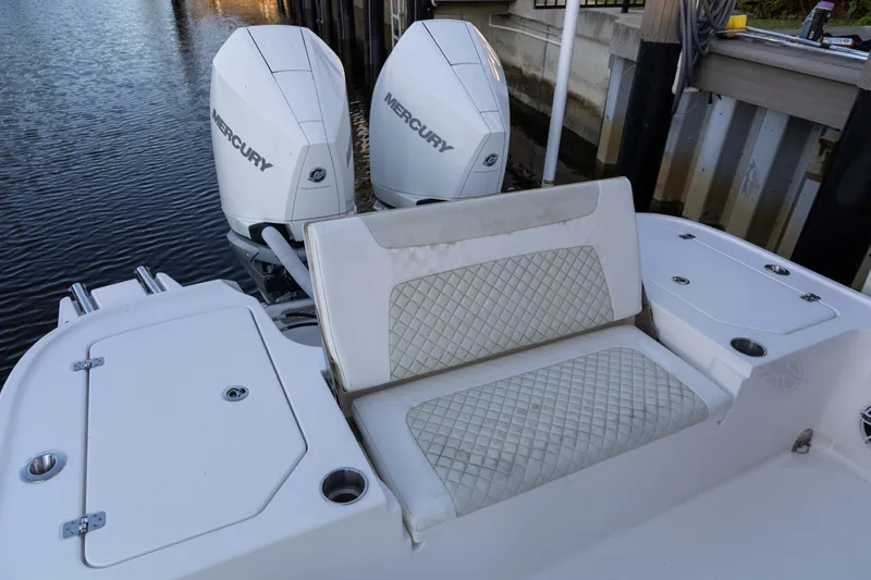  Yacht Photos Pics 2022 Caymas 28 HB Twin boat with dual Mercury engines and cushioned seating.