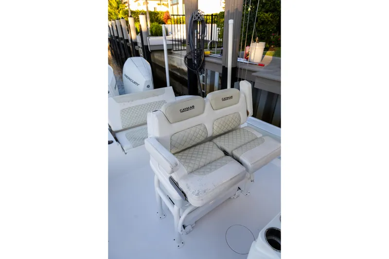  Yacht Photos Pics 2022 Caymas 28 HB Twin boat with cushioned seating and Mercury engines.