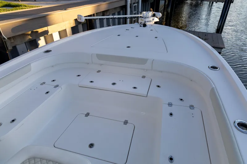  Yacht Photos Pics 2022 Caymas 28 HB Twin boat deck with storage compartments and fishing rod holders.