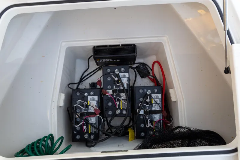  Yacht Photos Pics Battery compartment of 2022 Caymas 28 HB Twin boat with wiring and charger.