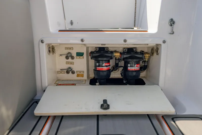  Yacht Photos Pics 2005 Marlago 35 boat fuel system compartment with dual filters and control switches.