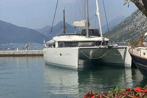 Seafox 1 Yacht Photos Pics 2015 Lagoon 400 S2 catamaran docked in scenic mountain marina.