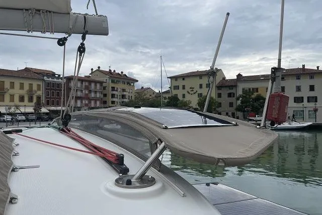 Seafox 1 Yacht Photos Pics Lagoon 400 S2 catamaran docked in a scenic marina, 2015 model.