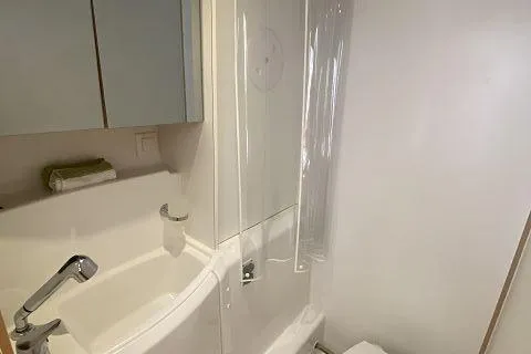 Seafox 1 Yacht Photos Pics Bathroom interior of 2015 Lagoon 400 S2 yacht, featuring modern fixtures and compact design.