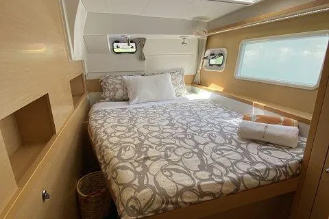 Seafox 1 Yacht Photos Pics Cozy bedroom in 2015 Lagoon 400 S2 yacht with modern decor and natural light.