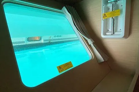 Seafox 1 Yacht Photos Pics Interior view of 2015 Lagoon 400 S2 catamaran with underwater window.