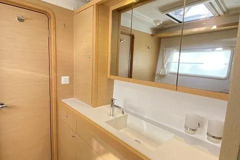 Seafox 1 Yacht Photos Pics Modern bathroom interior of 2015 Lagoon 400 S2 yacht with wooden cabinetry.