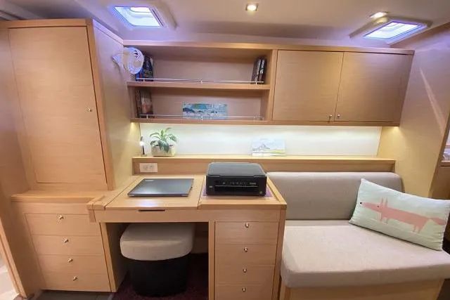 Seafox 1 Yacht Photos Pics Interior of 2015 Lagoon 400 S2 yacht with modern wood cabinetry and cozy seating area.