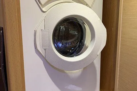 Seafox 1 Yacht Photos Pics Washing machine inside 2015 Lagoon 400 S2 yacht, featuring a compact design.