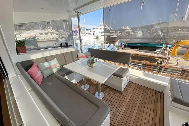 Seafox 1 Yacht Photos Pics 2015 Lagoon 400 S2 yacht interior with seating area and marina view.