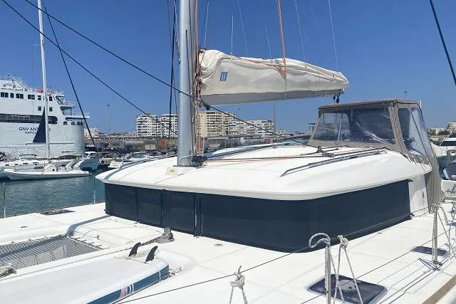 Seafox 1 Yacht Photos Pics 2015 Lagoon 400 S2 catamaran docked in a marina under clear blue skies.