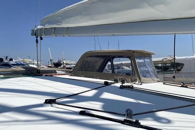 Seafox 1 Yacht Photos Pics 2015 Lagoon 400 S2 catamaran deck with sail and marina view.