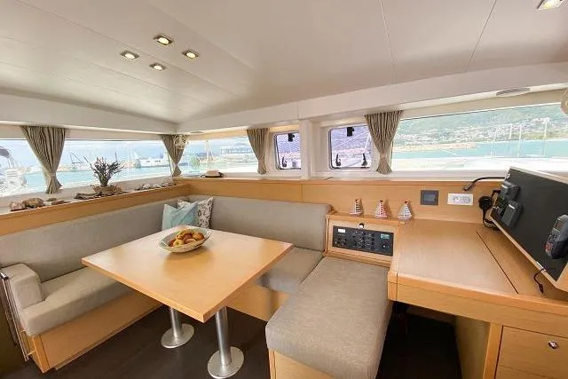 Seafox 1 Yacht Photos Pics Interior of 2015 Lagoon 400 S2 catamaran with dining area and scenic windows.