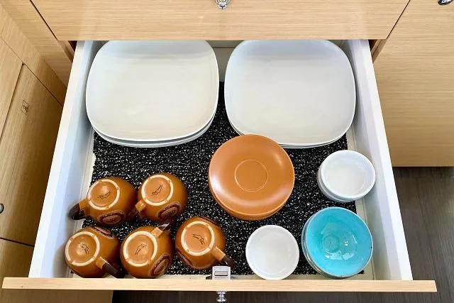 Seafox 1 Yacht Photos Pics Drawer with neatly arranged dishes and cups in a Lagoon 400 S2, 2015 model.