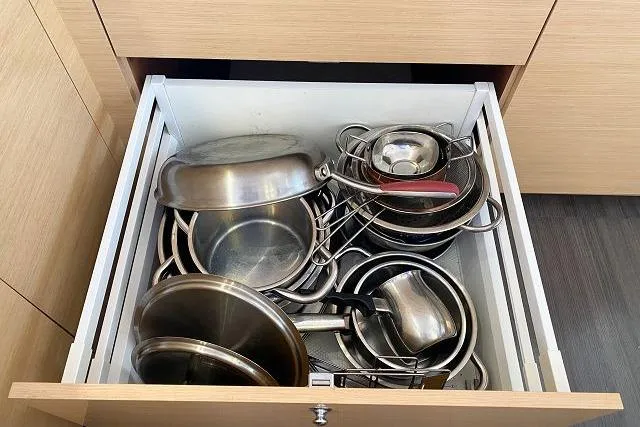 Seafox 1 Yacht Photos Pics Open kitchen drawer with assorted stainless steel pots and pans, Lagoon 400 S2, 2015.