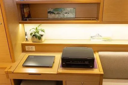Seafox 1 Yacht Photos Pics 2015 Lagoon 400 S2 yacht interior with desk, laptop, printer, and plant.