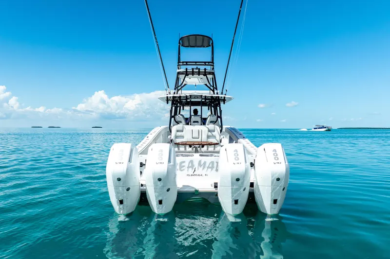  Yacht Photos Pics 2024 Freeman 42 boat with quad engines on clear blue water.