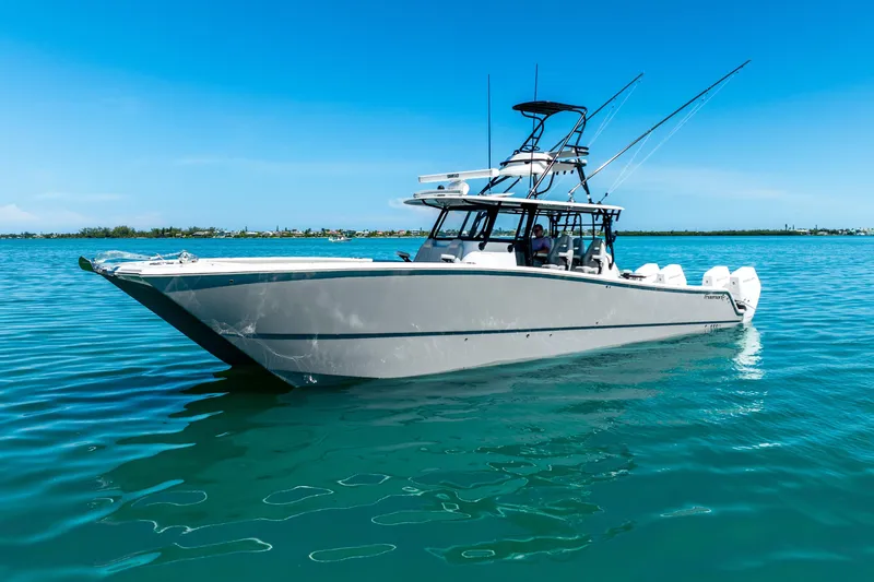  Yacht Photos Pics 2024 Freeman 42 boat on calm blue water under clear sky.