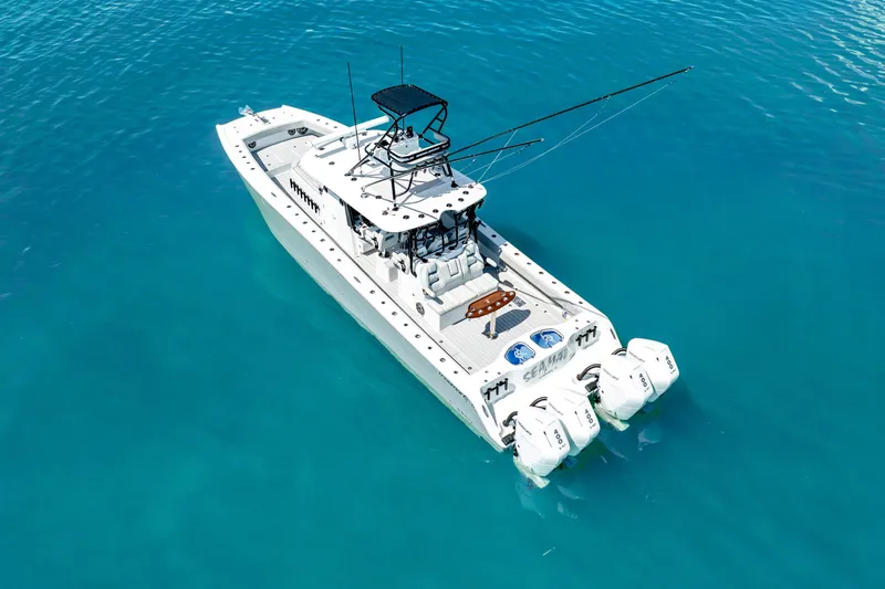  Yacht Photos Pics 2024 Freeman 42 boat on clear blue water, aerial view.