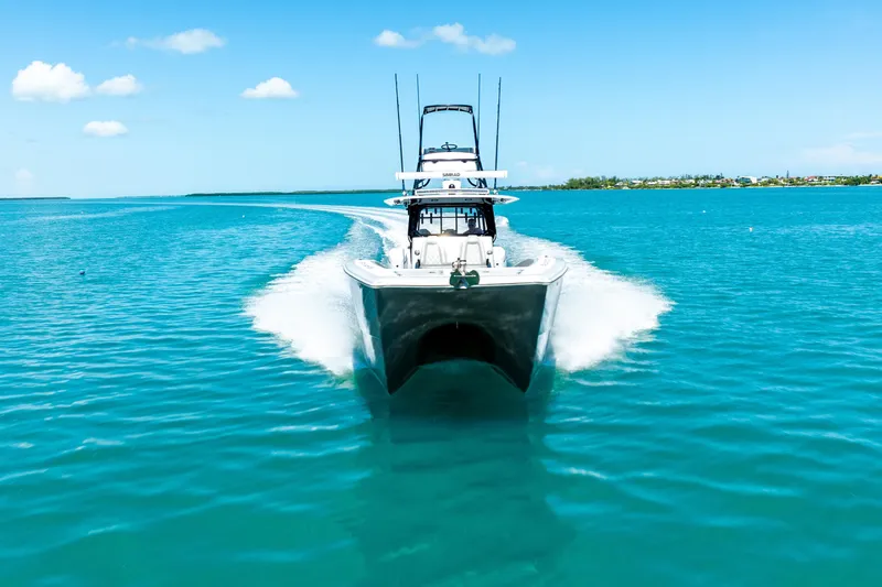  Yacht Photos Pics 2024 Freeman 42 boat cruising on clear blue water under a sunny sky.