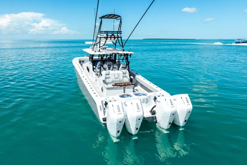  Yacht Photos Pics 2024 Freeman 42 boat with quad engines on clear blue water.