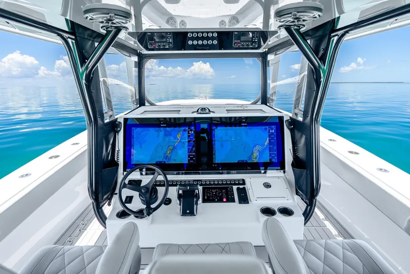  Yacht Photos Pics 2024 Freeman 42 boat cockpit with advanced navigation screens and ocean view.