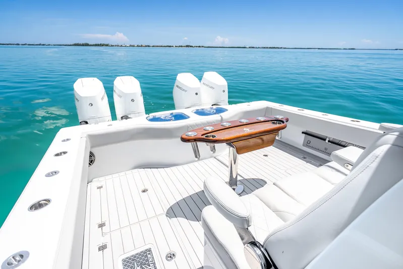  Yacht Photos Pics 2024 Freeman 42 boat with four engines, luxurious seating, and ocean view.