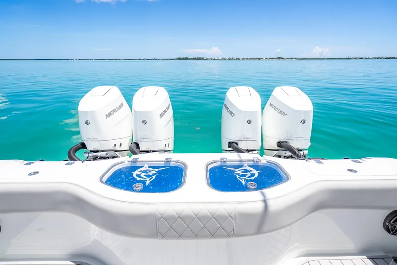  Yacht Photos Pics 2024 Freeman 42 boat with four Mercury engines on clear blue water.