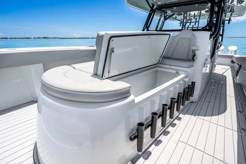  Yacht Photos Pics 2024 Freeman 42 boat interior with open storage compartment and rod holders on deck.
