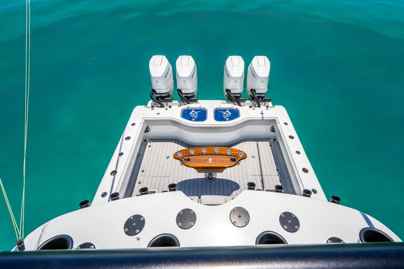  Yacht Photos Pics 2024 Freeman 42 boat with four engines on turquoise water.