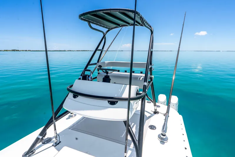  Yacht Photos Pics 2024 Freeman 42 boat on calm turquoise waters under clear blue sky.