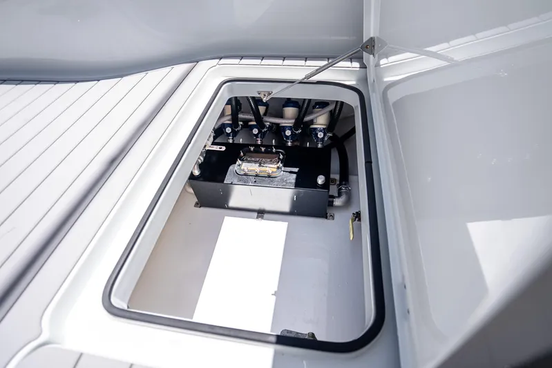  Yacht Photos Pics Open hatch of 2024 Freeman 42 boat showing internal components and storage area.