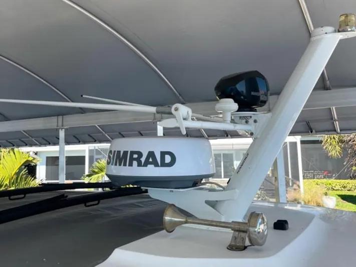  Yacht Photos Pics Simrad radar on 2021 Axopar 37 Sun Top BRABUS Trim boat under canopy.