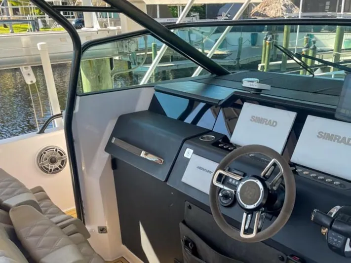  Yacht Photos Pics 2021 Axopar 37 Sun Top BRABUS Trim boat dashboard with Simrad navigation system.