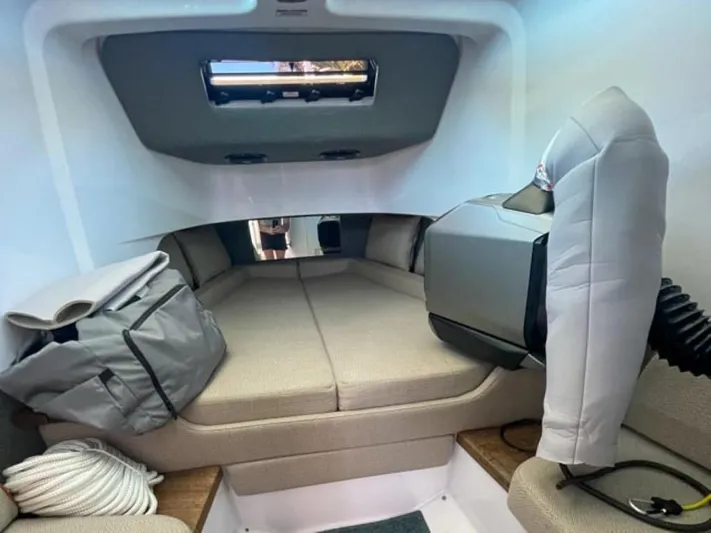 Yacht Photos Pics Interior cabin of 2021 Axopar 37 Sun Top BRABUS Trim with seating and storage.