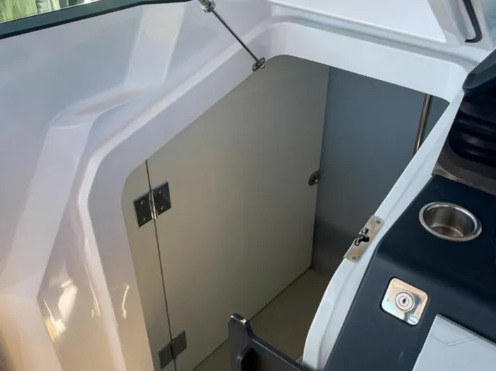  Yacht Photos Pics Interior view of 2021 Axopar 37 Sun Top BRABUS Trim boat cabin entrance.