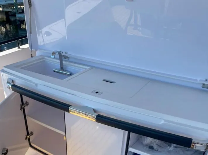  Yacht Photos Pics 2021 Axopar 37 Sun Top BRABUS Trim boat sink and counter area.