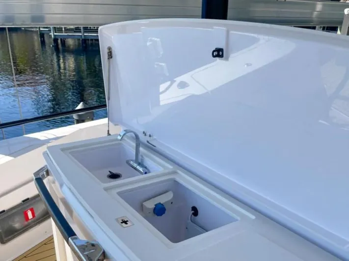  Yacht Photos Pics Axopar 37 Sun Top BRABUS Trim 2021 boat sink and storage compartments.