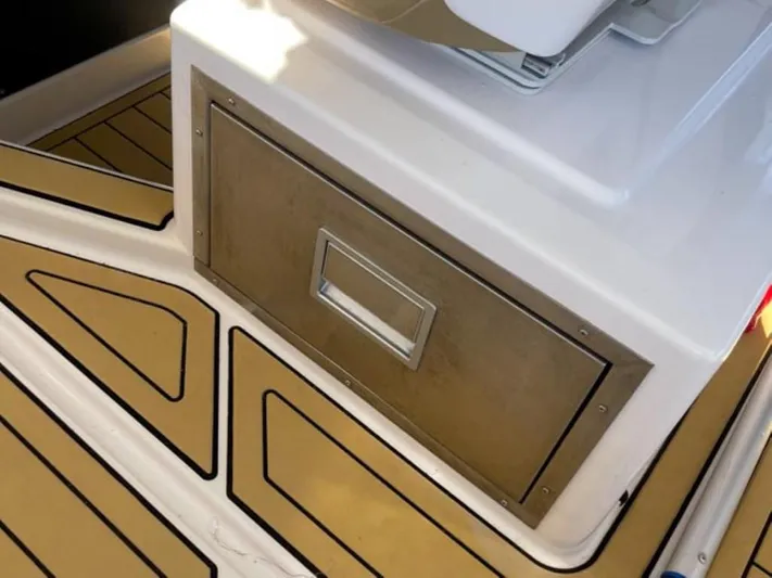  Yacht Photos Pics Axopar 37 Sun Top BRABUS Trim 2021, featuring sleek deck design and storage compartment.