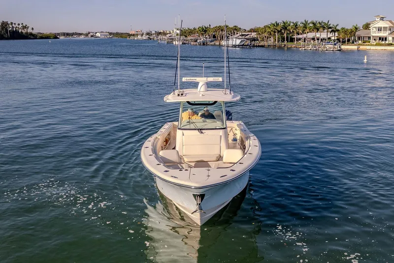  Yacht Photos Pics 2022 Grady-White Canyon 336 boat cruising on a calm waterway.