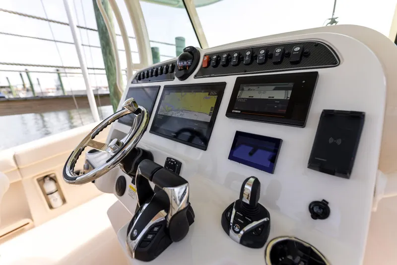  Yacht Photos Pics 2022 Grady-White Canyon 336 boat dashboard with advanced navigation and control systems.