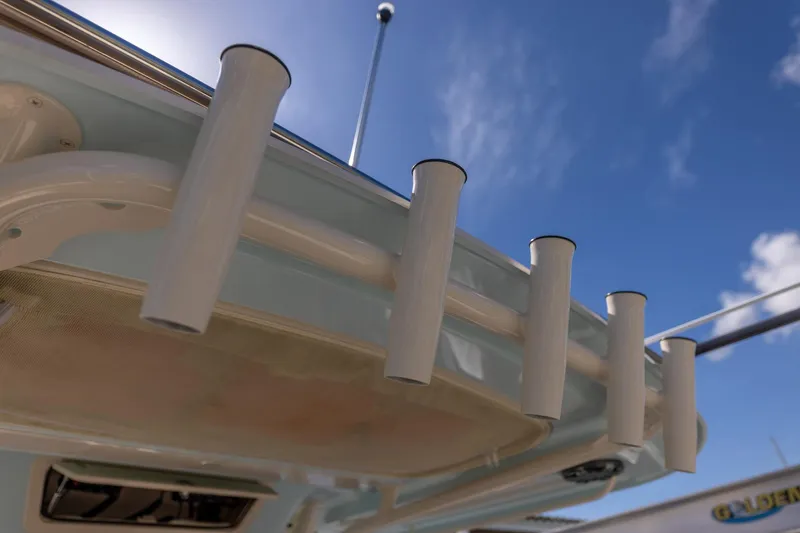  Yacht Photos Pics Rod holders on a 2022 Grady-White Canyon 336 boat under a clear blue sky.