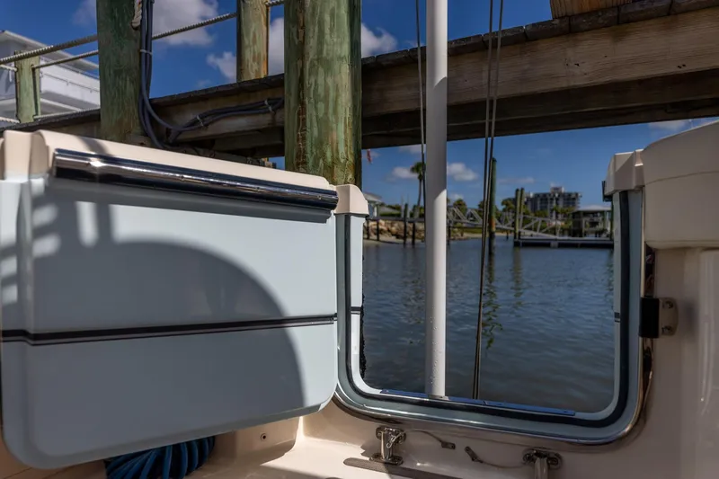  Yacht Photos Pics 2022 Grady-White Canyon 336 boat docked by a scenic waterfront.