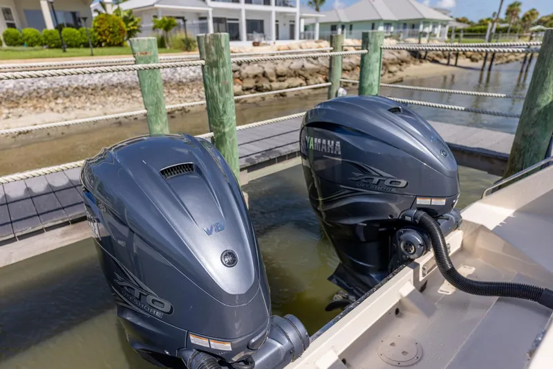  Yacht Photos Pics Twin Yamaha XTO outboard engines on a 2022 Grady-White Canyon 336 boat at a dock.