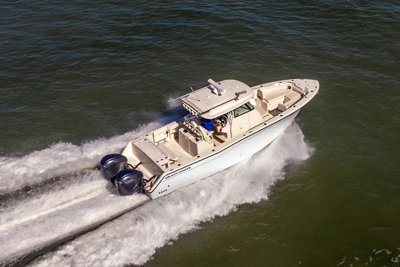  Yacht Photos Pics 2022 Grady-White Canyon 336 boat cruising on open water, aerial view.